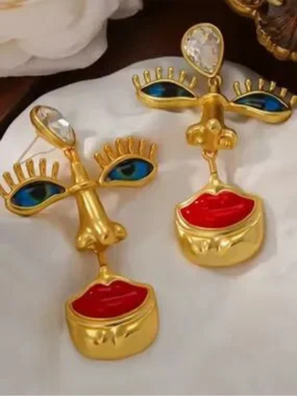 Anthropologie Gold Tone Face Drop Earrings with Blue Eye and Red Lip Accents